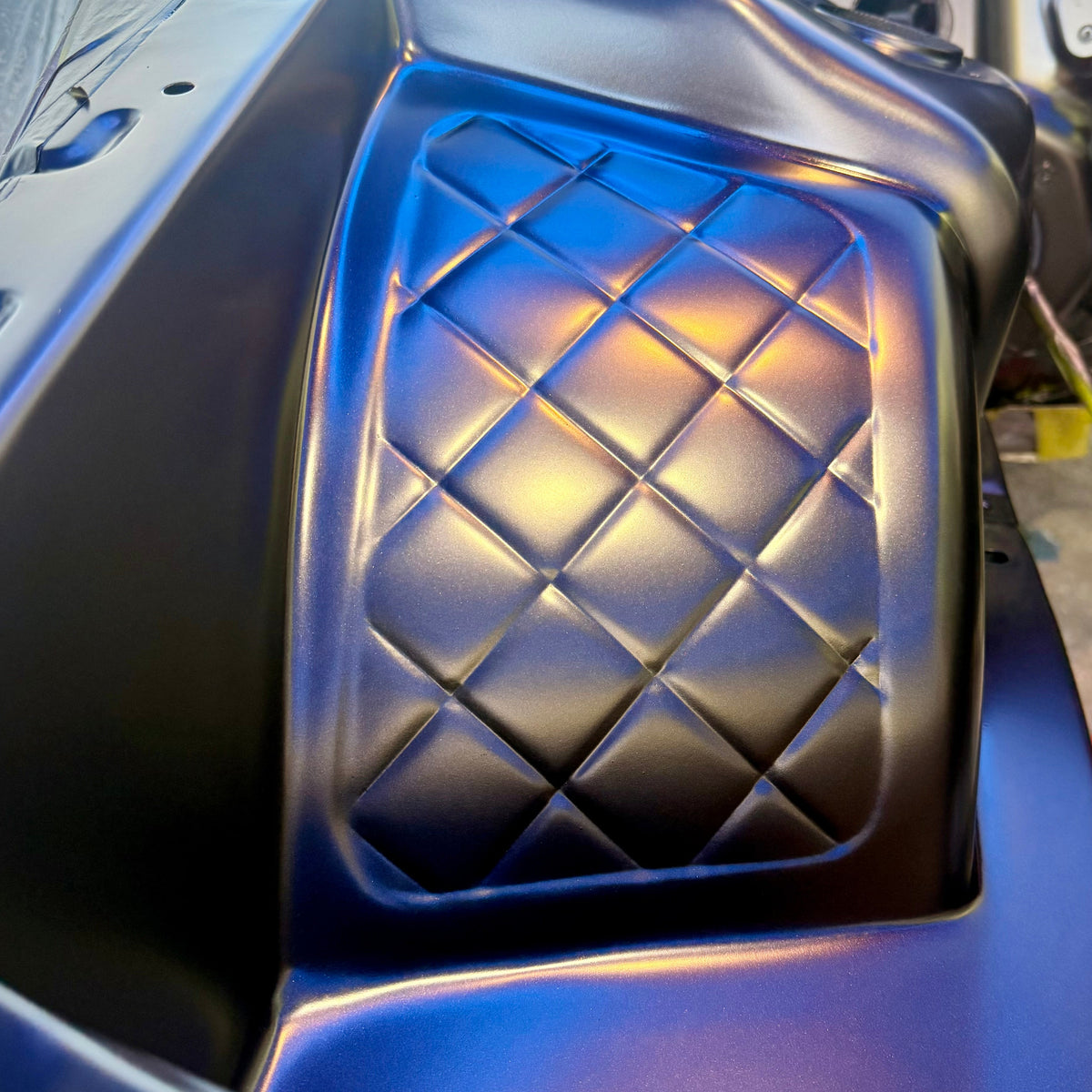 Toyota JZX100 Chaser front wheel tub fitted in the engine bay, diamond pattern shown