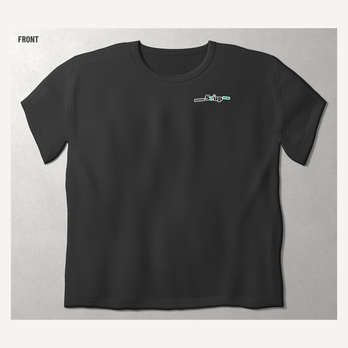 Soup Syndicate Big Lockup tee in washed black, front view with the Soup sticker row on the chest